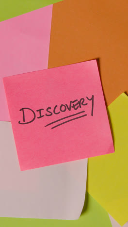 Vertical-Video-Business-Concept-Of-Revolving-Sticky-Notes-With-Discovery-Written-On-Top-Note-1